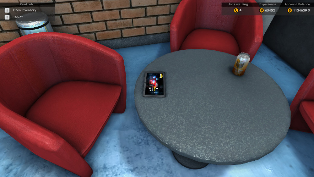 The one lone Easter Egg in Car Mechanic Simulator 2015 is located on the small table by the red chairs.